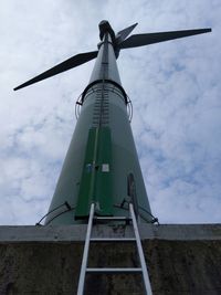 Low angle view of windmill against sky