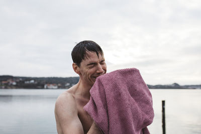 Man drying himself with towel