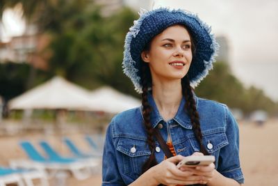 Young woman using mobile phone