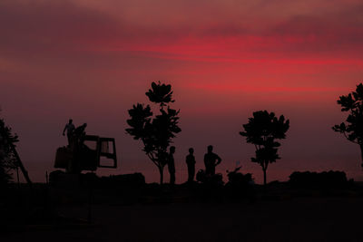 Silhouette trees against sky during sunset