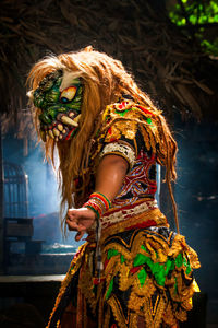 The portrait of performer rampak buto traditional mask folk dancing 