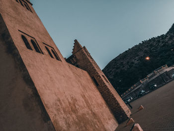 Low angle view of historic building against clear sky