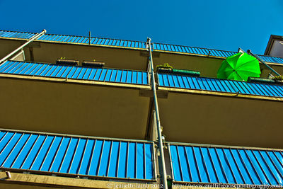 Low angle view of built structure against blue sky