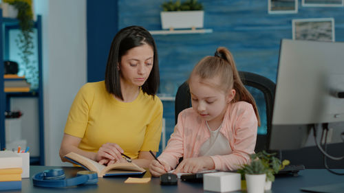 Friends sitting on table