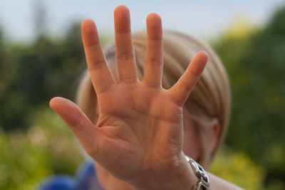 Close-up of woman showing stop gesture