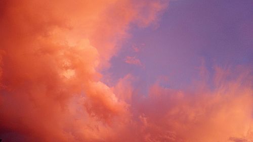 Low angle view of cloudy sky at sunset