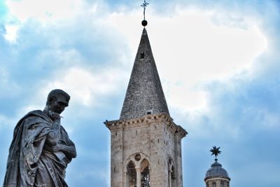 Low angle view of statue against sky