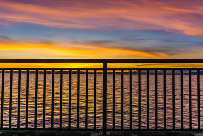 Scenic view of sea against orange sky