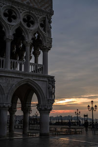 View of historic building against sky during sunset