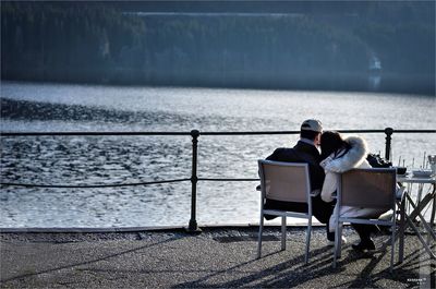 Full length of man sitting on bench