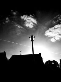 Low angle view of silhouette street light against sky