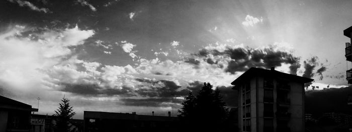 Low angle view of building against cloudy sky
