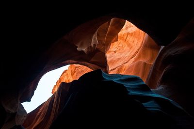 Low angle view of rock formation against sky