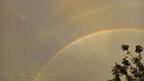 Low angle view of rainbow against sky