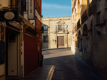 Alley amidst buildings in city