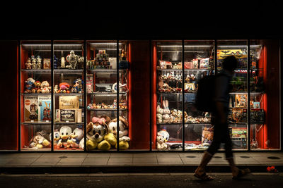 Rear view of man standing in store