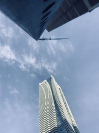 Low angle view of skyscraper against sky