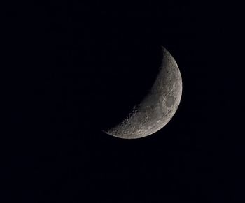 Low angle view of moon against sky at night