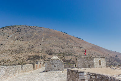 View of fort against blue sky