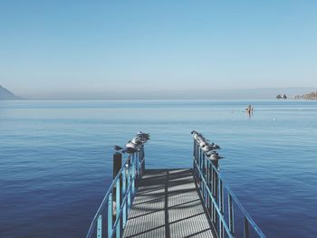 Scenic view of sea against clear blue sky