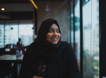 Portrait of smiling young woman