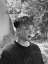 Close-up portrait of young man looking away