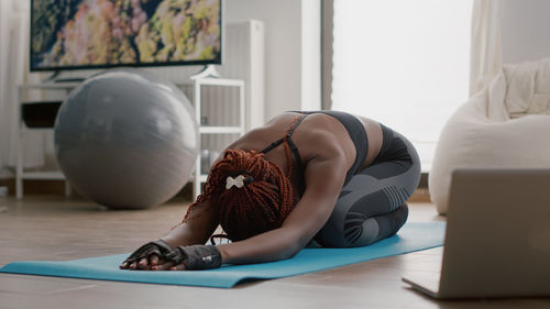 Woman exercising at home