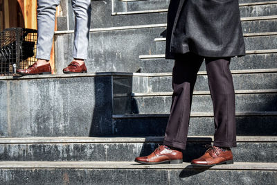 Low section of people standing on staircase
