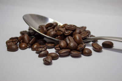 Close-up of coffee beans on table