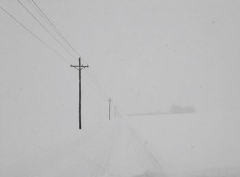 Power lines against sky