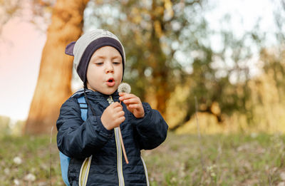 Boy holding flower