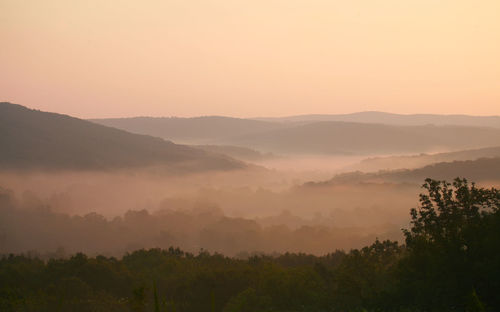 Scenic view of mountains against sky during sunset