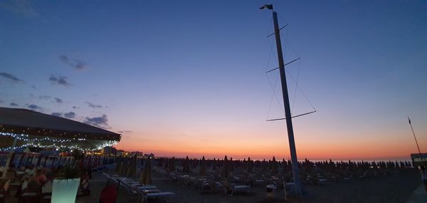 Panoramic view of beach against sky during sunset