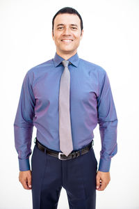 Portrait of a smiling young man against white background