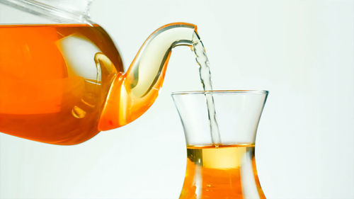 Close-up of drink against white background