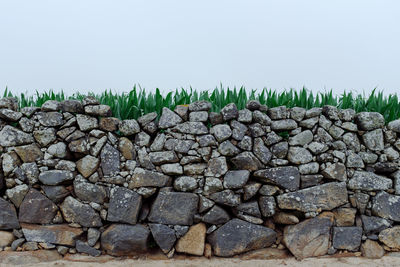 Stone wall against clear sky