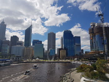 Modern buildings in city against sky