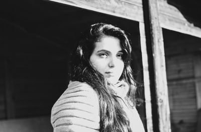 Portrait of beautiful young woman standing outdoors