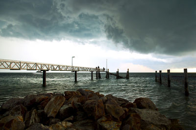 Pier over sea against sky