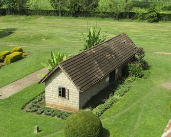 High angle view of cottage on field