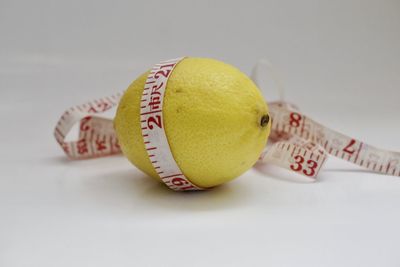 Close-up of yellow ball on table