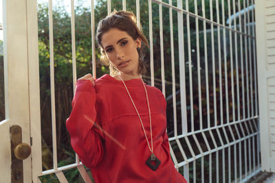Portrait of young woman standing outdoors