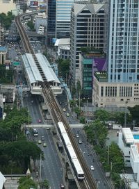 High angle view of railroad tracks amidst buildings in city