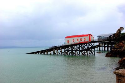 Pier over sea against sky