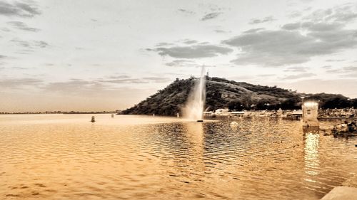 Scenic view of water against sky