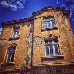 Low angle view of building against blue sky