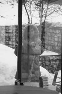 Portrait of girl standing in snow