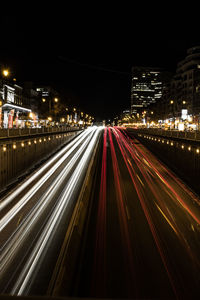 High angle view of light trails on city street at night