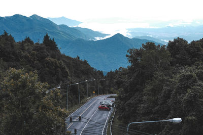 High angle view of trees and mountains against sky