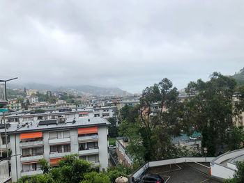 High angle view of trees and buildings against sky